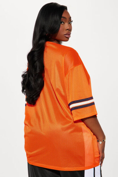 Camiseta deportiva oversized con estampado y detalles de encaje - Image 7